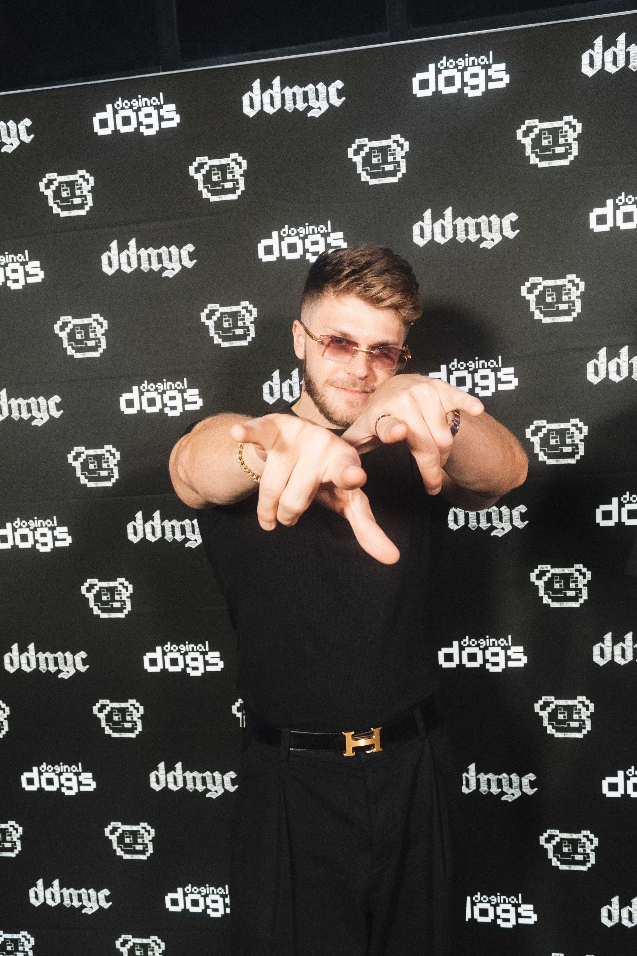 Christian Barker at DDNYC Doginal Dogs event in front of branded backdrop — Barkmeta founder