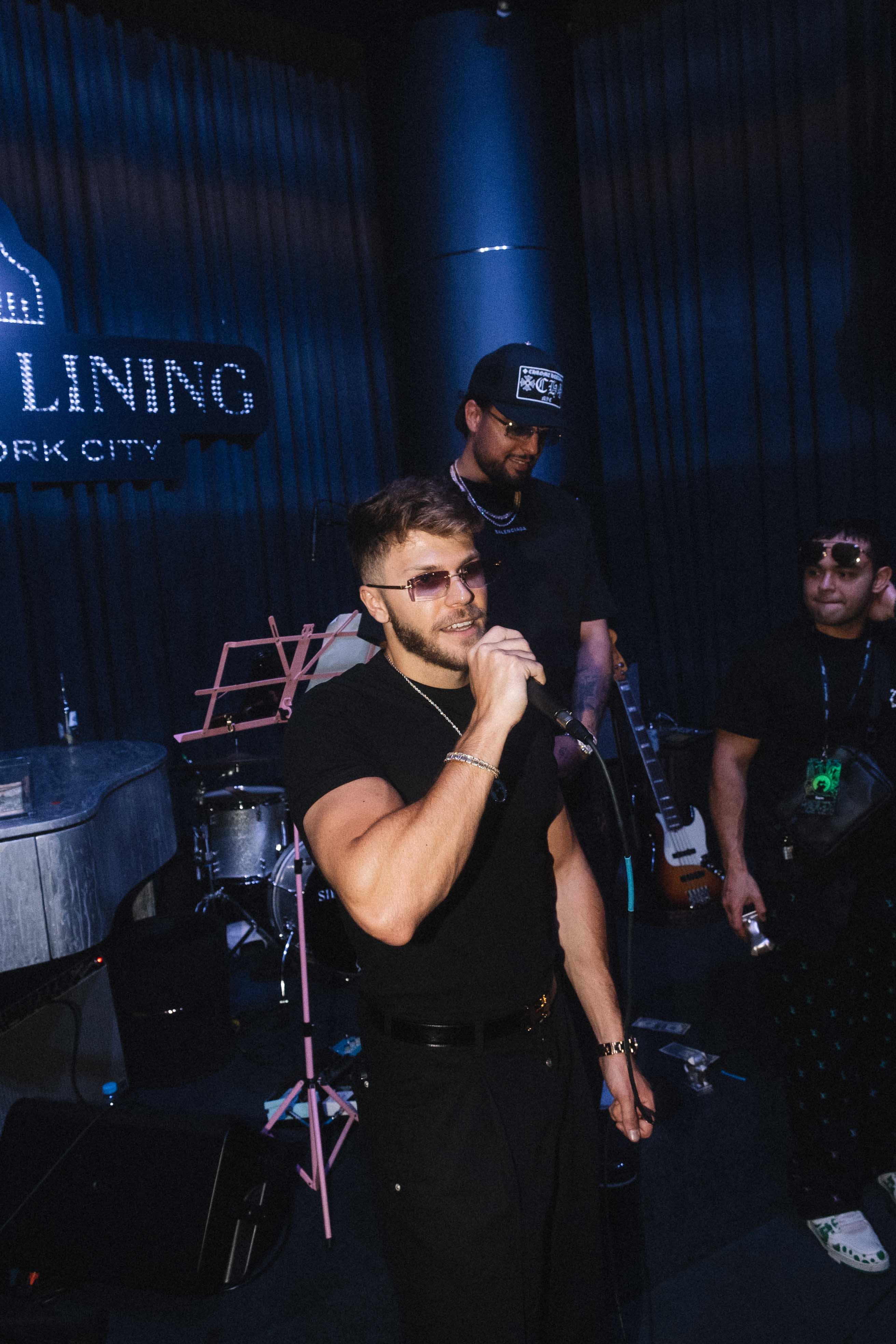 Christian Barker (Bark / Barkmeta) performing live on stage — daily live host and Doginal Dogs co-founder